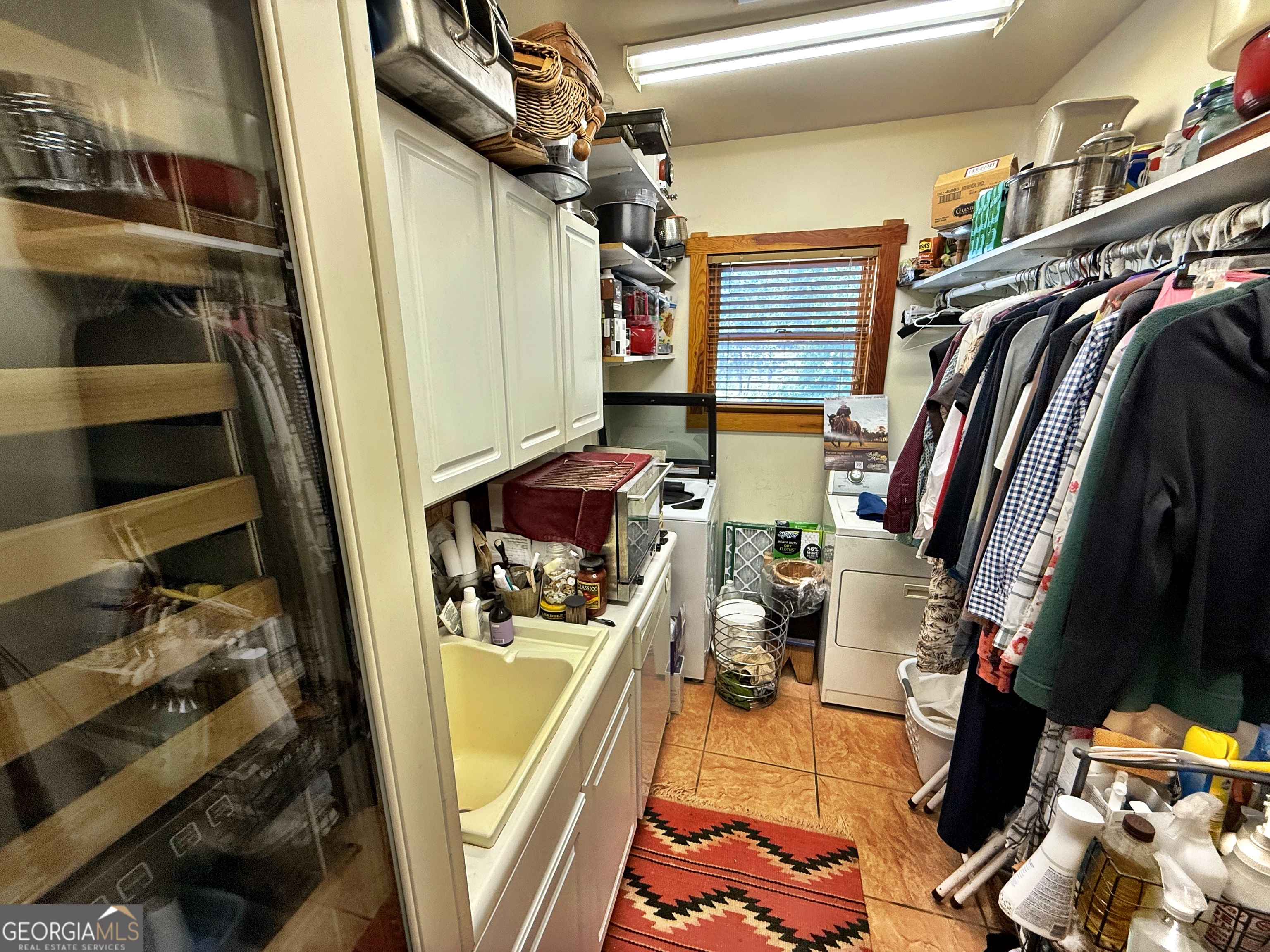 120 Torbet Road Forsyth, GA 31029 - Photo 43 of 118 a view of walk in closet with clothes and shoes
