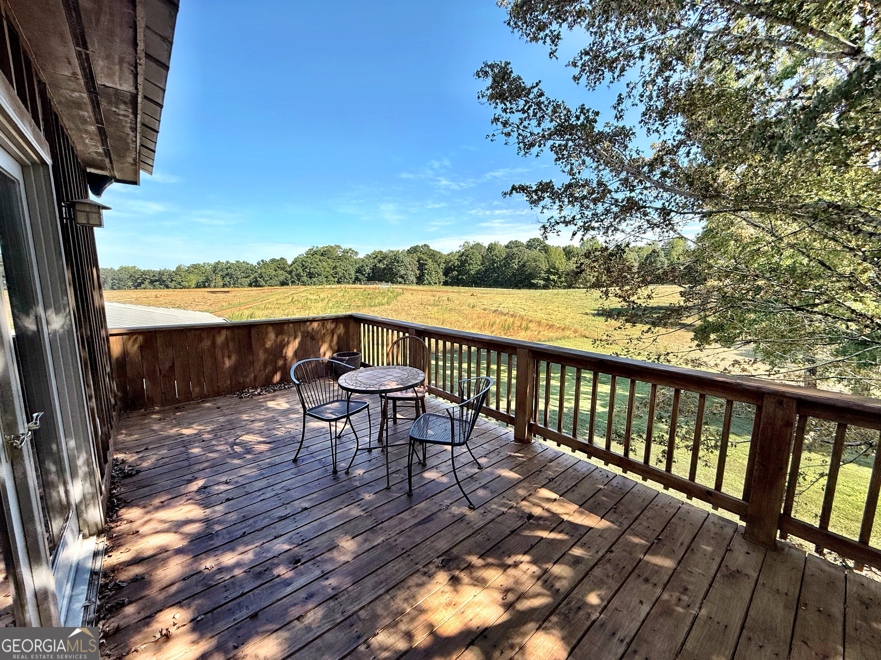120 Torbet Road Forsyth, GA 31029 - Photo 55 of 118 a view of a balcony with mountain view and wooden floor