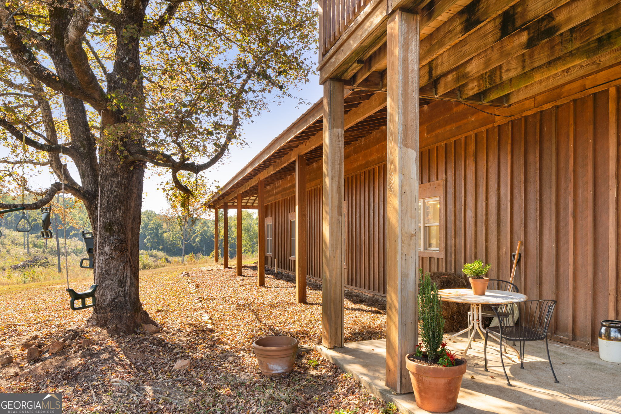 120 Torbet Road Forsyth, GA 31029 - Photo 74 of 118 a backyard of a house with table and chairs
