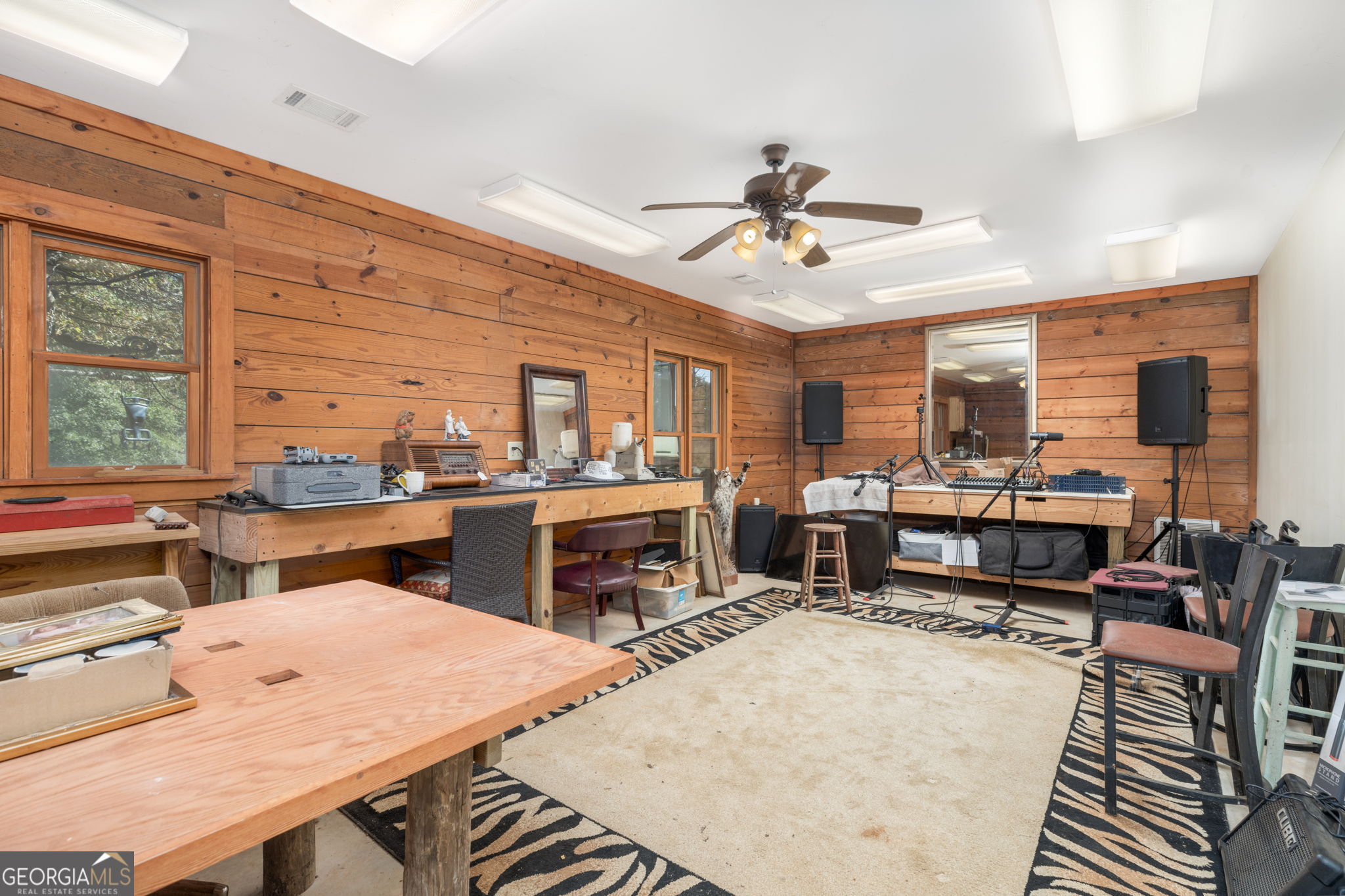 120 Torbet Road Forsyth, GA 31029 - Photo 79 of 118 a living room with furniture a flat screen tv and a table