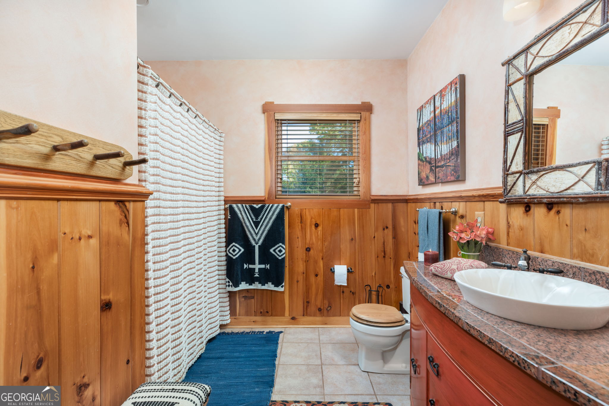 120 Torbet Road Forsyth, GA 31029 - Photo 85 of 118 a bathroom with a granite countertop toilet a sink and a mirror