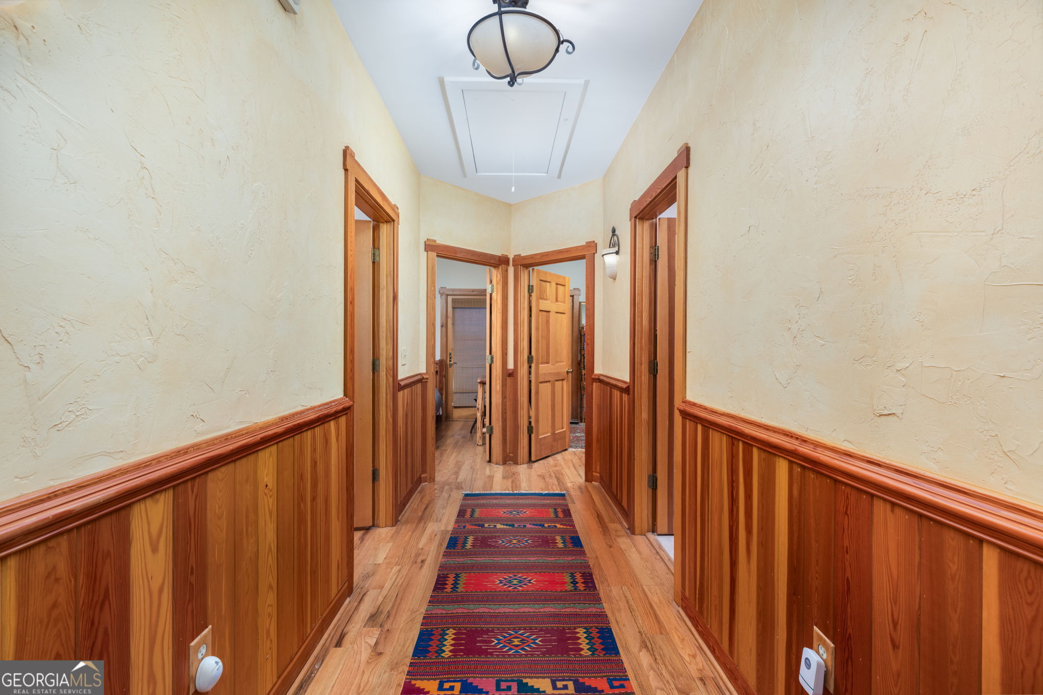 120 Torbet Road Forsyth, GA 31029 - Photo 92 of 118 a view of a hallway with wooden floor and windows
