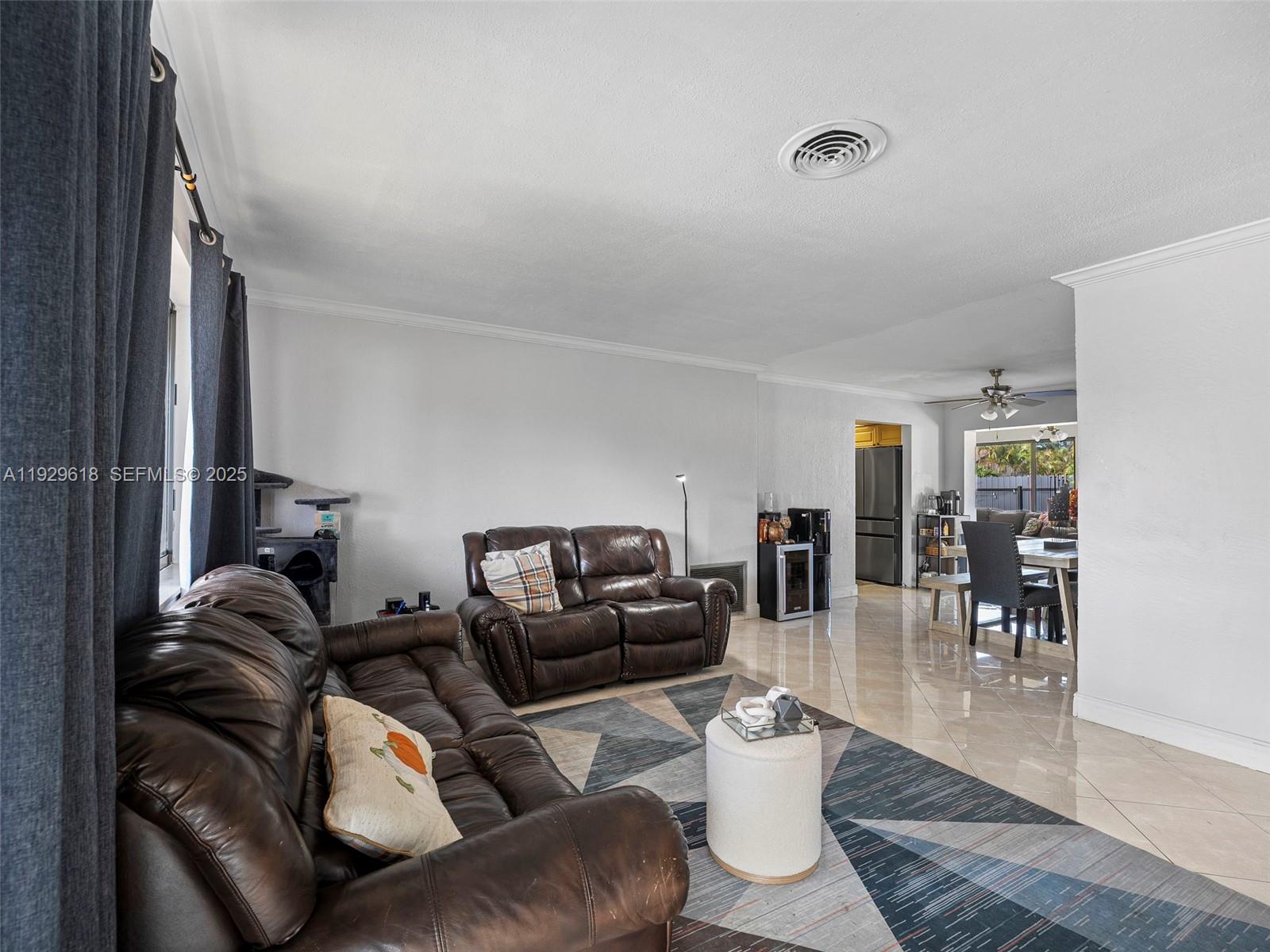 4461 Northwest 6th Street Plantation, FL 33317 - Photo 11 of 30 a living room with furniture and wooden floor