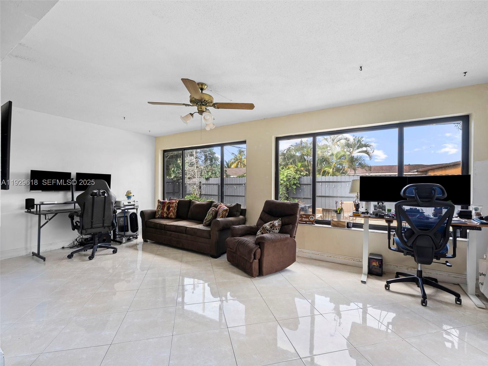 4461 Northwest 6th Street Plantation, FL 33317 - Photo 15 of 30 a living room with furniture and a window