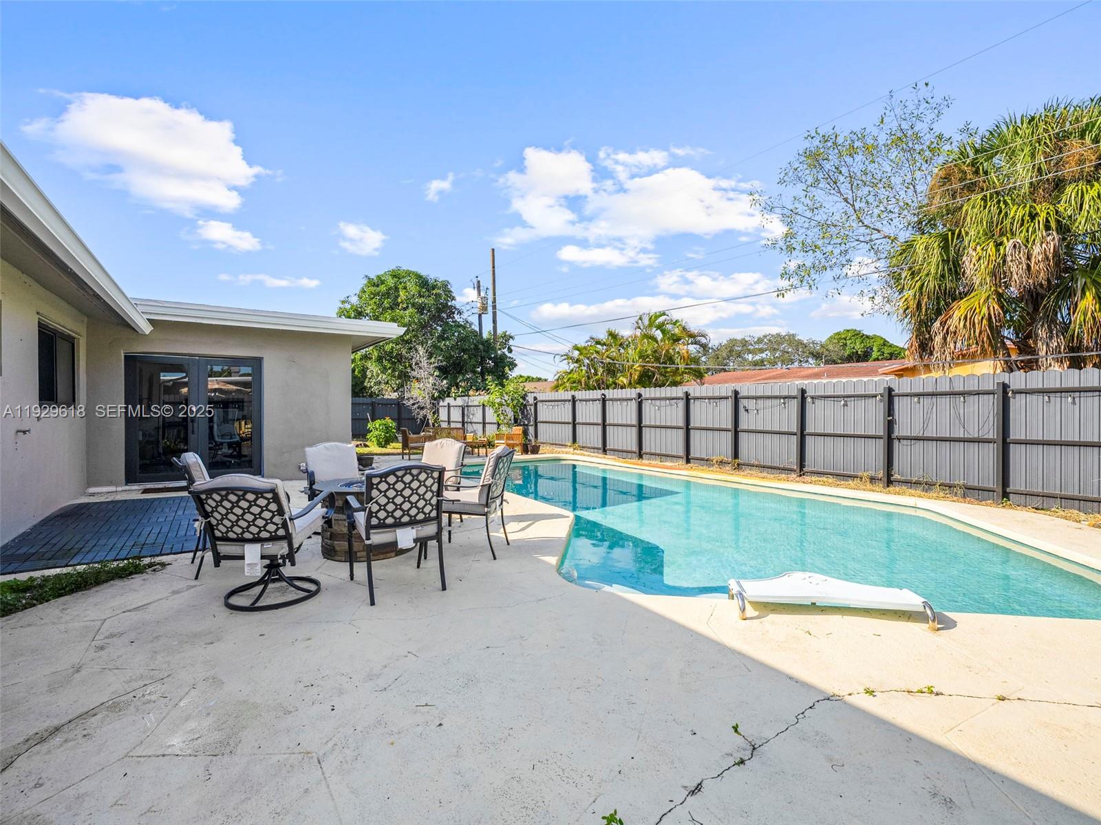4461 Northwest 6th Street Plantation, FL 33317 - Photo 24 of 30 a view of a backyard with sitting area