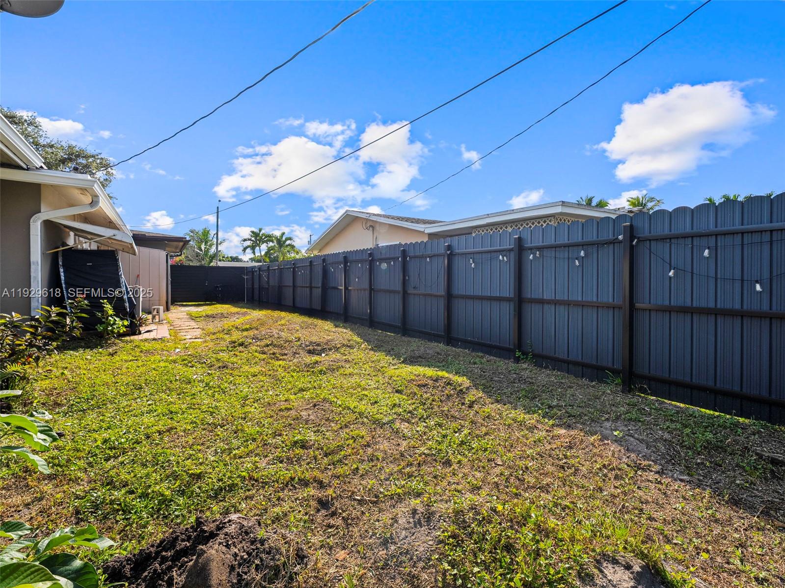 4461 Northwest 6th Street Plantation, FL 33317 - Photo 26 of 30 a view of a backyard with wooden fence