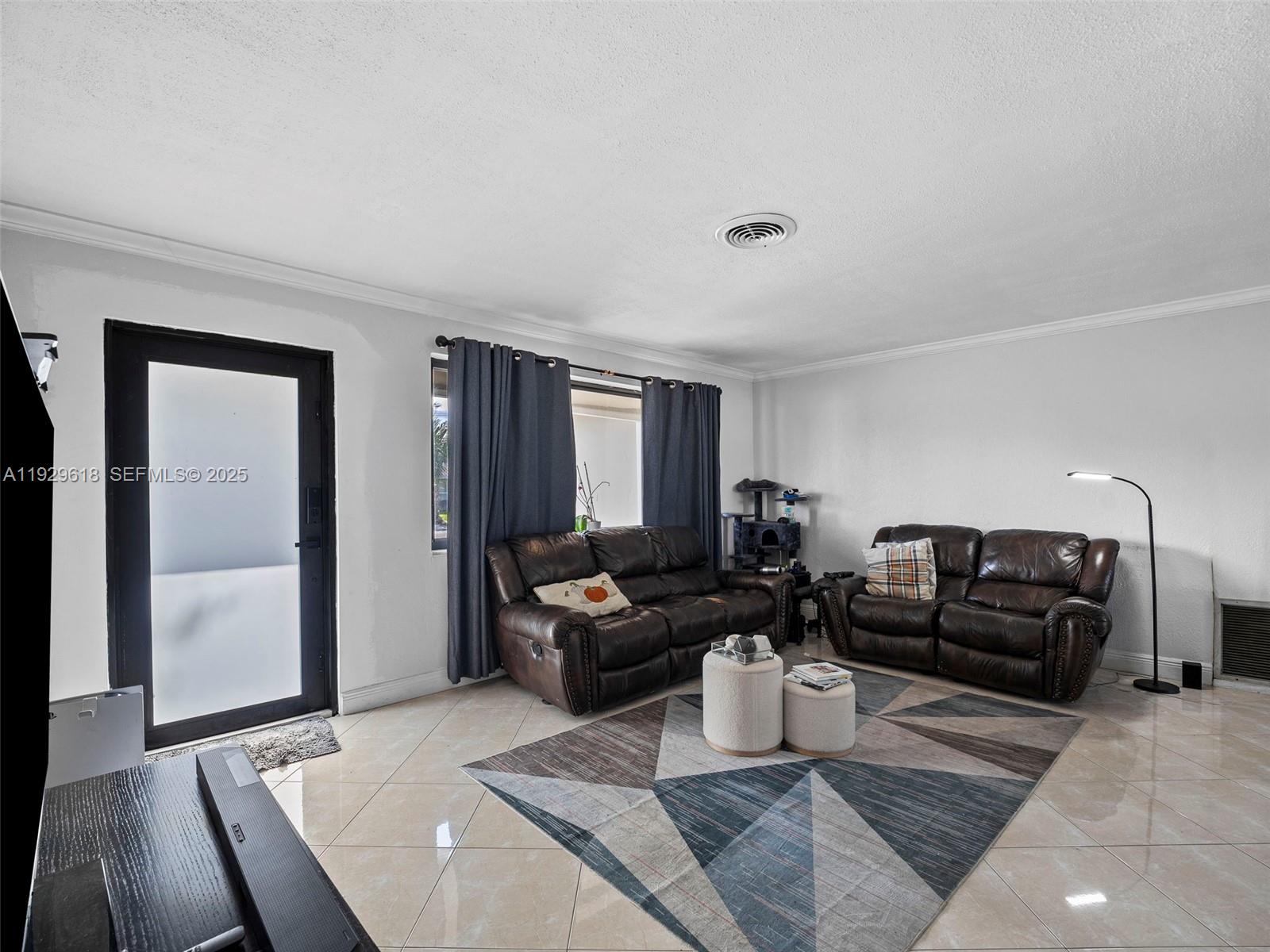 4461 Northwest 6th Street Plantation, FL 33317 - Photo 5 of 30 a living room with furniture and wooden floor