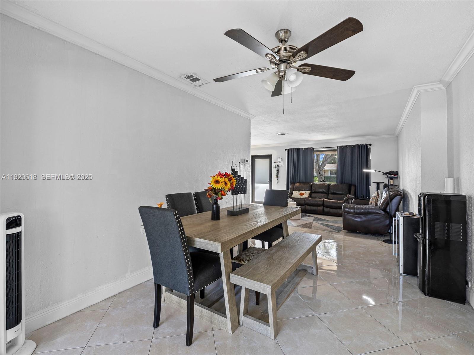 4461 Northwest 6th Street Plantation, FL 33317 - Photo 7 of 30 a view of a dining room with furniture