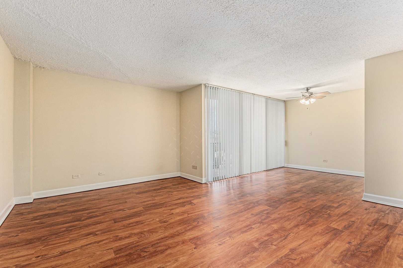 1043 South York Road, Unit 202 Bensenville, IL 60106 - Photo 5 of 19 a view of an empty room with wooden floor