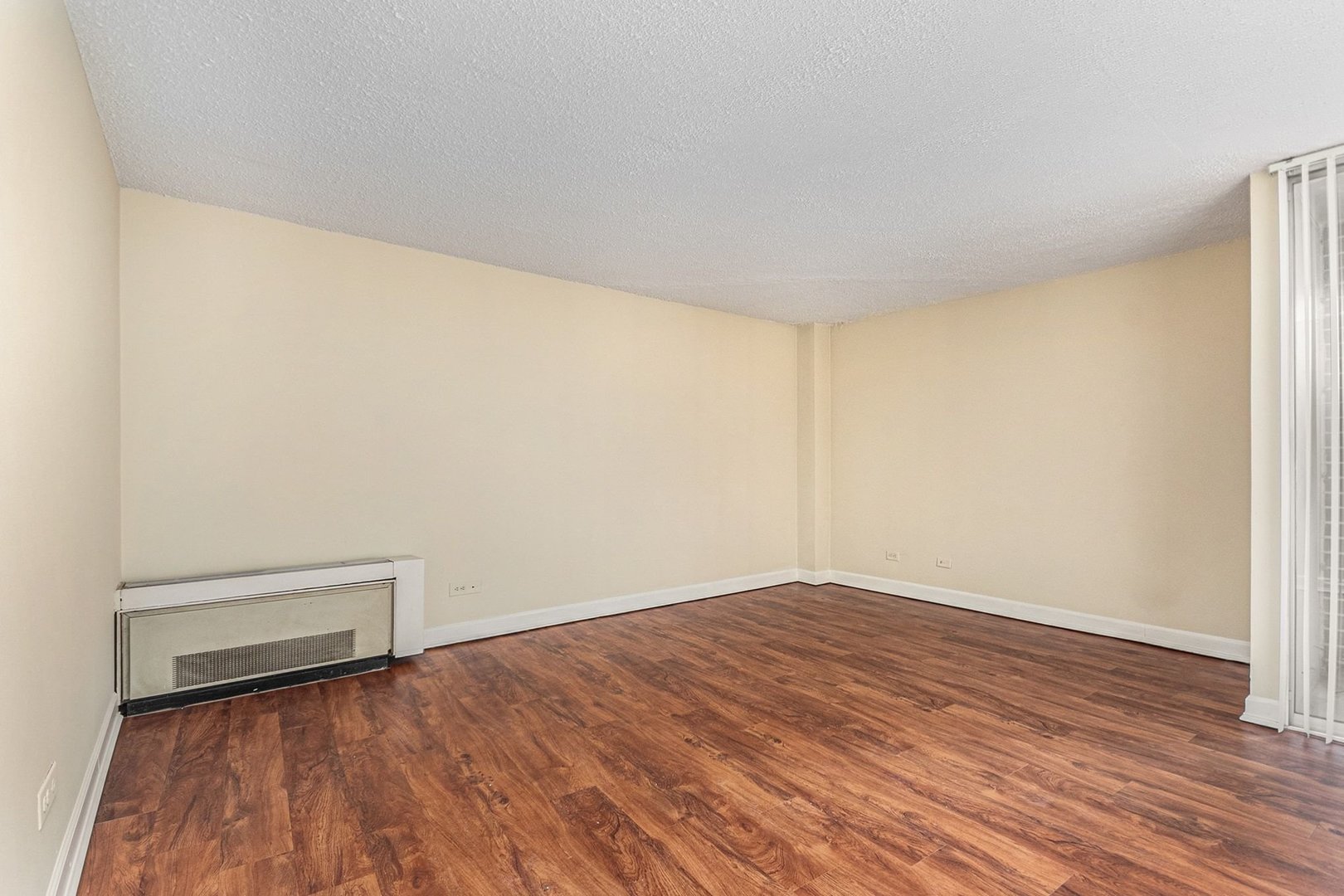 1043 South York Road, Unit 202 Bensenville, IL 60106 - Photo 6 of 19 a view of empty room with wooden floor