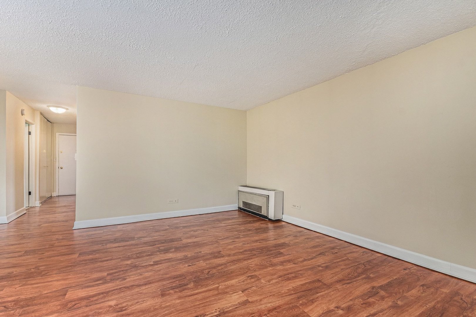 1043 South York Road, Unit 202 Bensenville, IL 60106 - Photo 7 of 19 a view of empty room with wooden floor