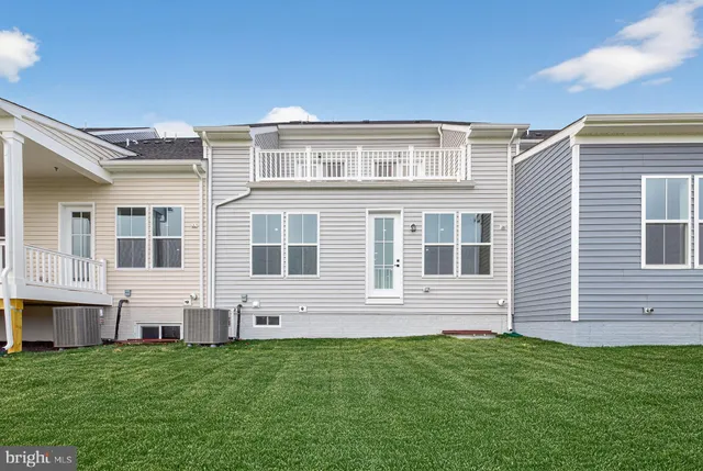 a view of house with yard