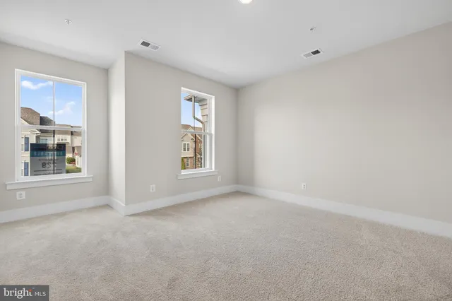 a view of empty room with windows