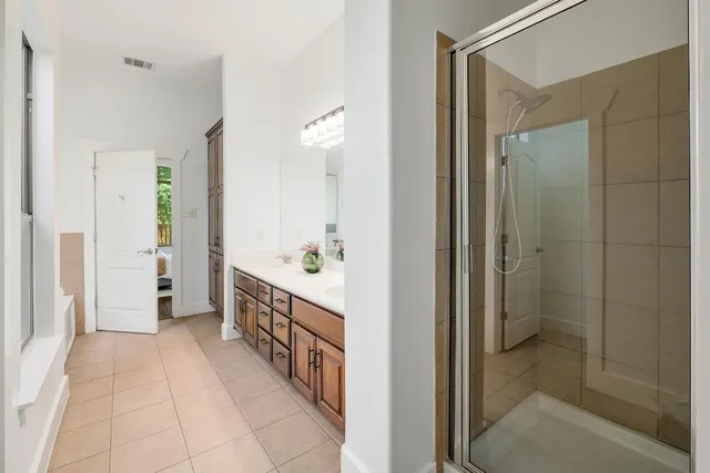 a bathroom with a sink and shower