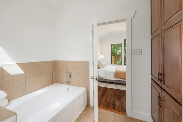 a en suite bathroom with a tub and shower
