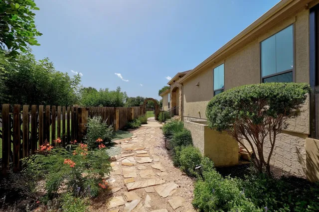 a backyard of a house with lots of green space