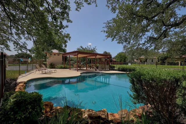 a view of a swimming pool with a garden