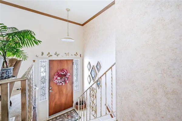 a view of entryway with a lot of flowers
