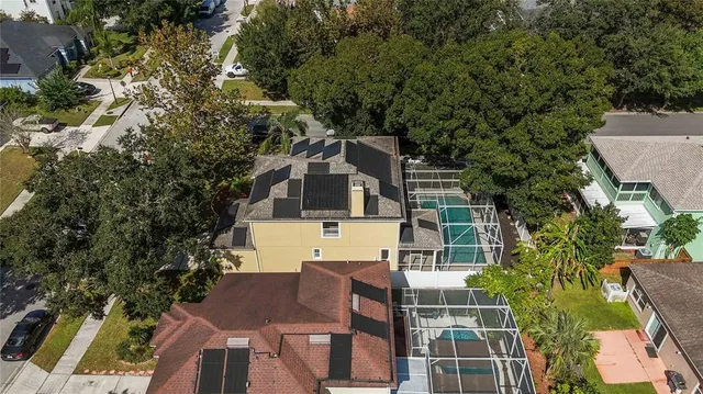 an aerial view of a house with a yard