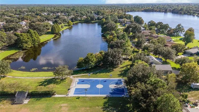 an aerial view of house with yard swimming pool and outdoor seating
