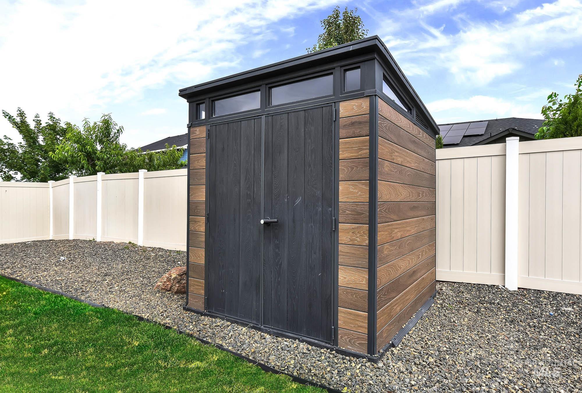 5676 East Zaffre Ridge Street Boise, ID 83716 - Photo 48 of 50 Modern outdoor storage shed featuring a sloped roof design with transom windows