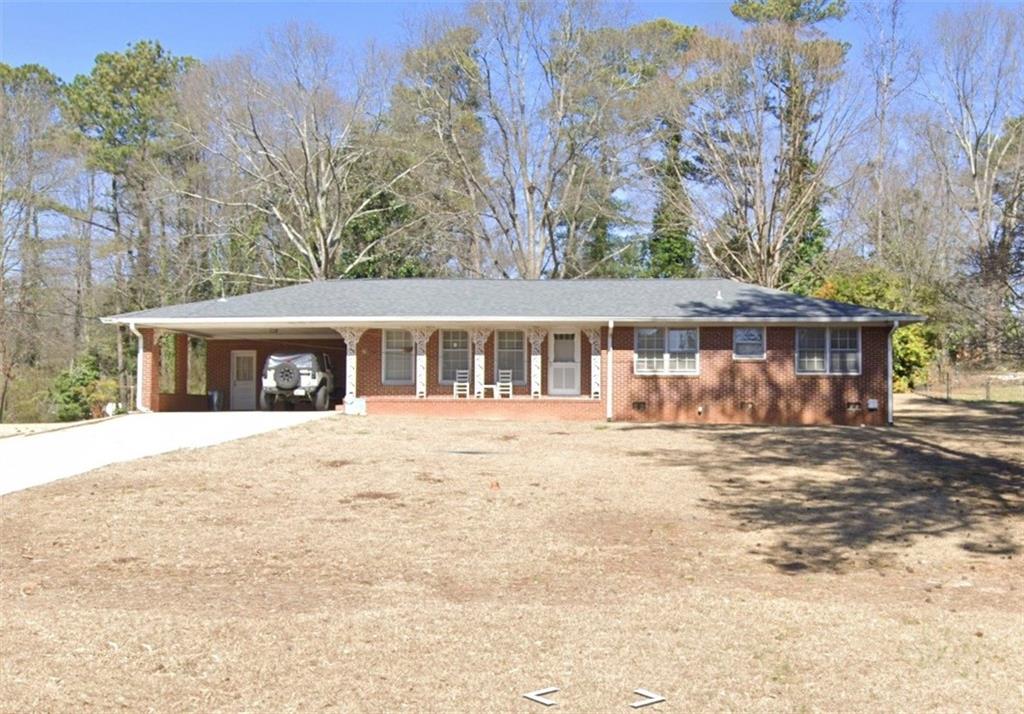 546 Lee Road Mableton, GA 30126 - Photo 1 of 1 front view of house with a yard and trees