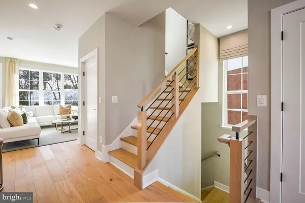 a living room with furniture and painting on the wall