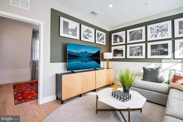 a living room with furniture and a table