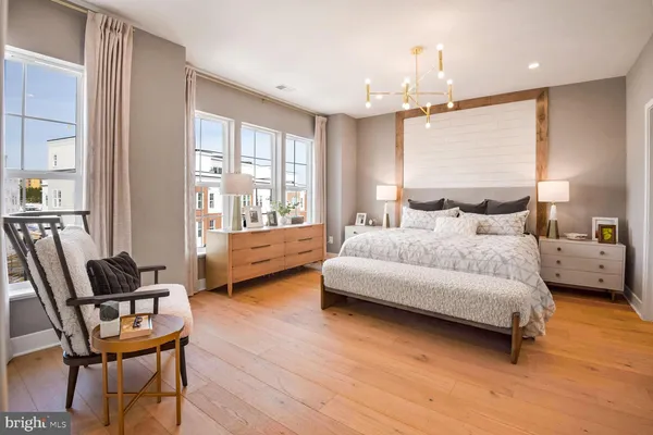 a bedroom with a bed and a chair
