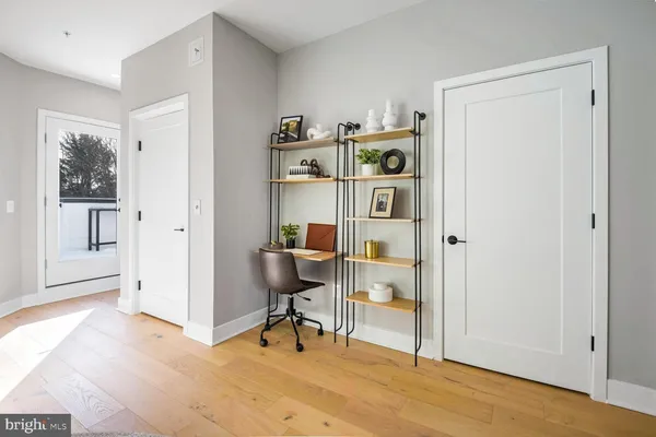 a bathroom with a granite countertop sink mirror vanity and toilet