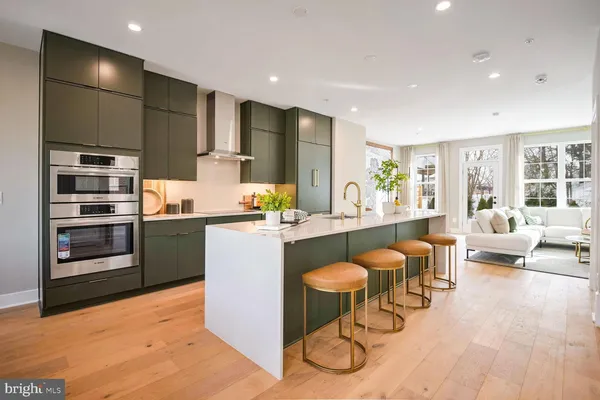 a spacious bathroom with a double vanity sink and a mirror