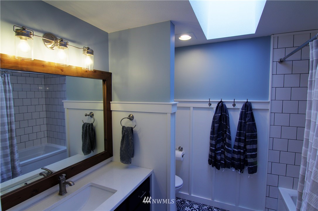 19002 Nutmeg Street Southwest Rochester, WA 98579 - Photo 11 of 19 a bathroom with a shower and a toilet