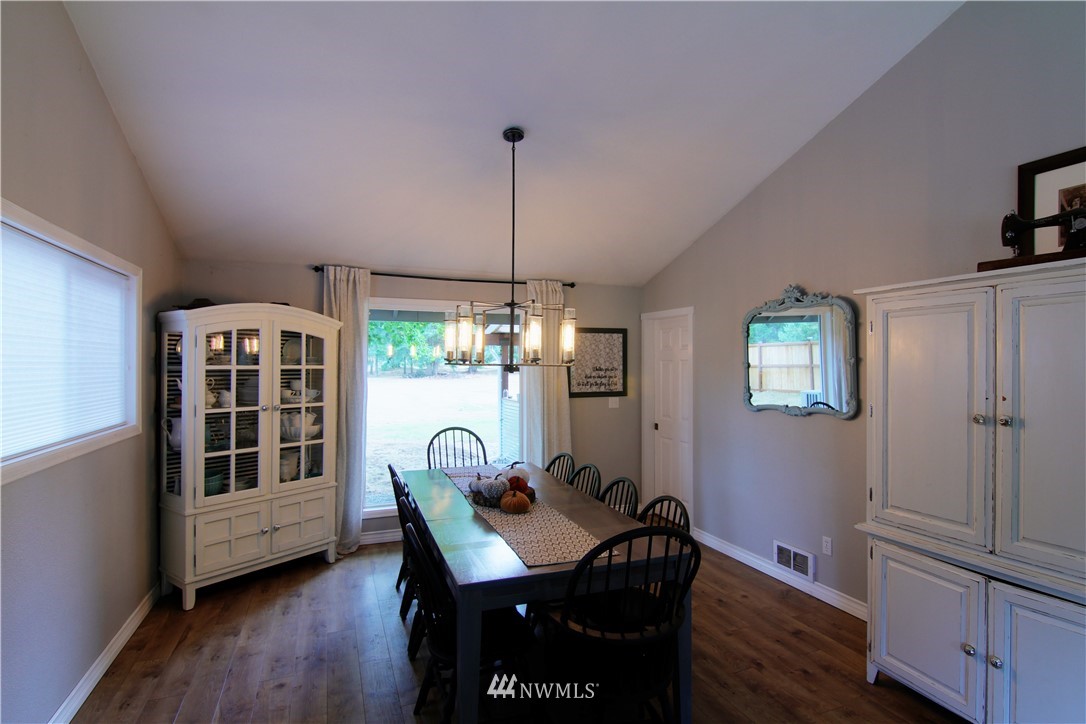 19002 Nutmeg Street Southwest Rochester, WA 98579 - Photo 6 of 19 a view of a dining room with furniture window and wooden floor