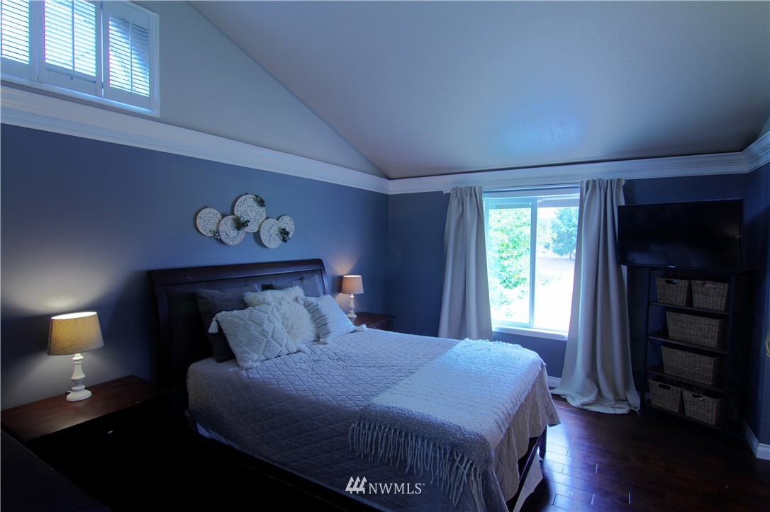 19002 Nutmeg Street Southwest Rochester, WA 98579 - Photo 8 of 19 a bedroom with a bed and a window