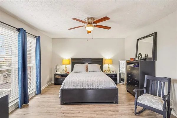 a bedroom with a bed and a window