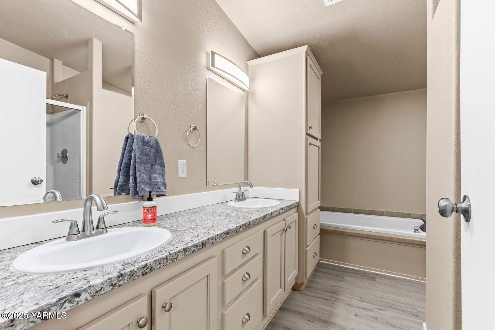 1023 Gibson Road Selah, WA 98942 - Photo 14 of 39 a bathroom with a granite countertop sink and a mirror