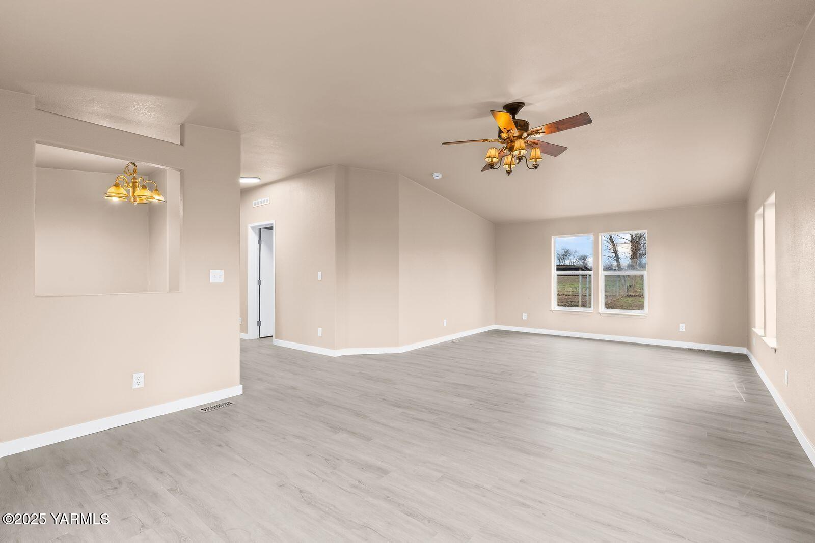 1023 Gibson Road Selah, WA 98942 - Photo 25 of 39 wooden floor in an empty room with a window