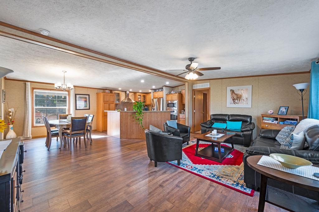 424 32 Road, Unit 378 Clifton, CO 81520 - Photo 2 of 15 a living room with furniture and wooden floor
