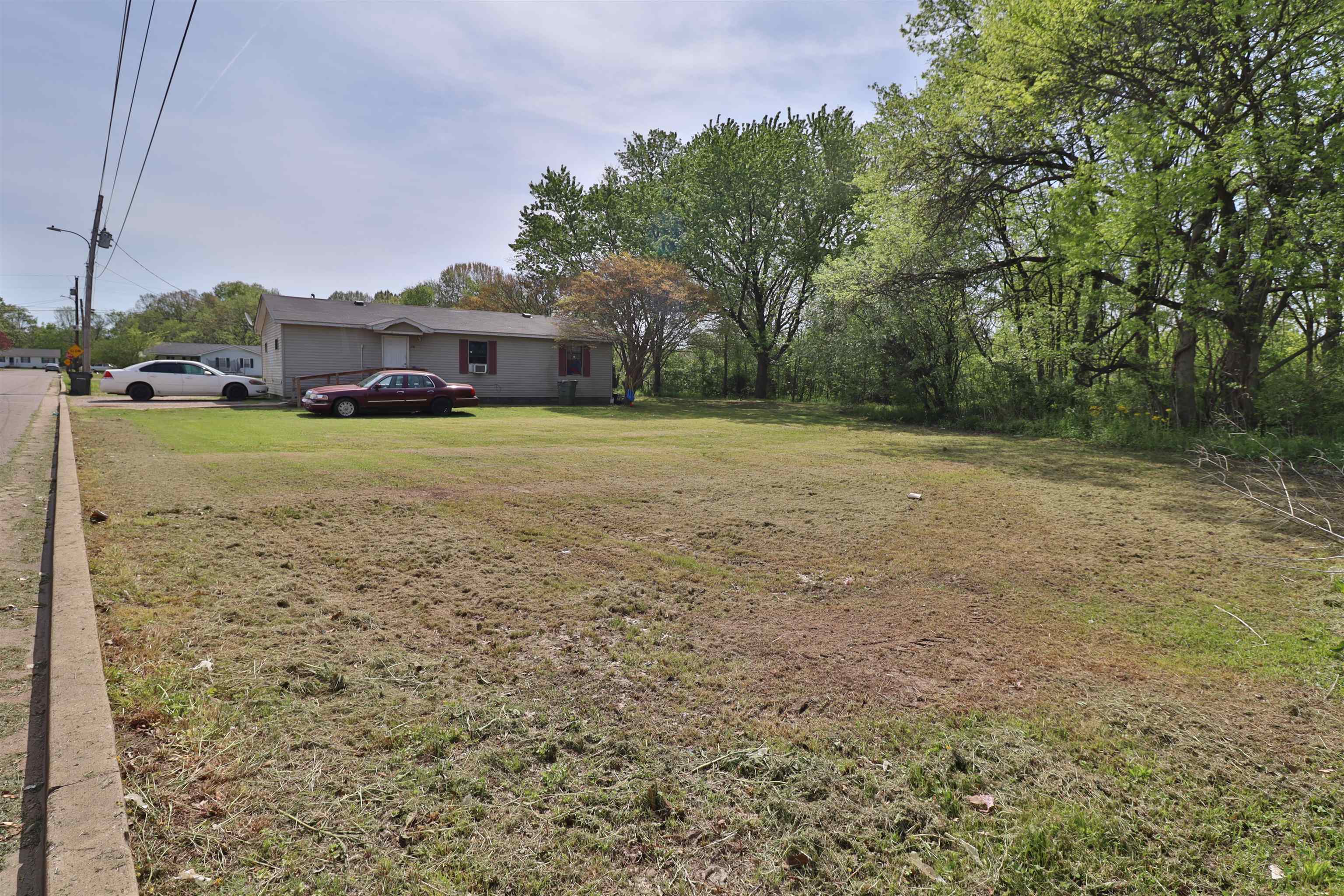 319 Wayne Avenue Ripley, TN 38063 - Photo 10 of 10 a small yard in front of the house