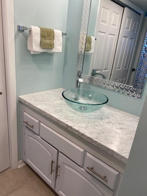1 Boca Ciega Point Boulevard, Unit 213 St. Petersburg, FL 33708 - Photo 20 of 33 a bathroom with a sink and a mirror