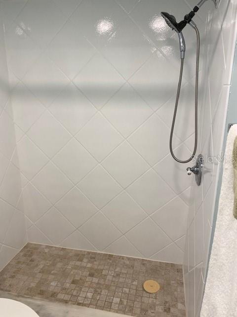 1 Boca Ciega Point Boulevard, Unit 213 St. Petersburg, FL 33708 - Photo 21 of 33 a bathroom with a glass shower door