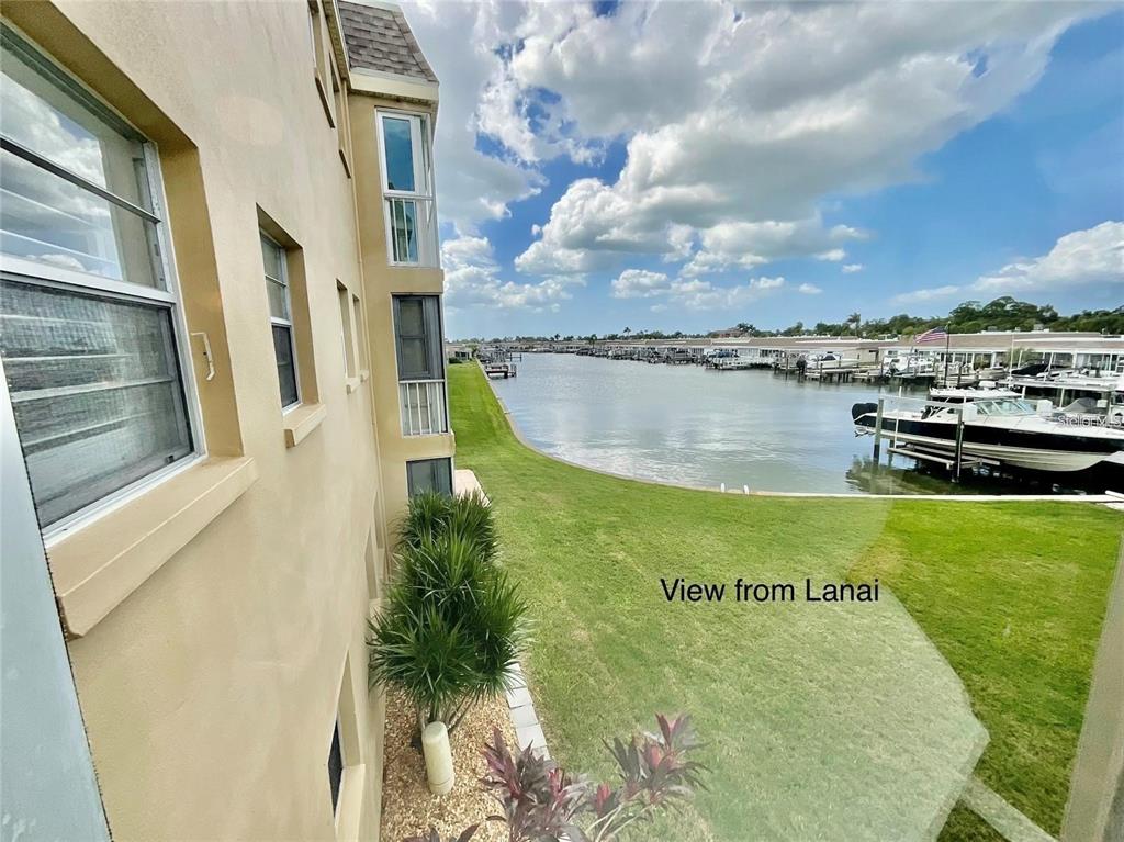 1 Boca Ciega Point Boulevard, Unit 213 St. Petersburg, FL 33708 - Photo 29 of 33 a view of a lake with a big yard