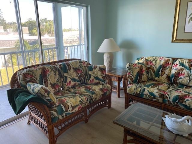 1 Boca Ciega Point Boulevard, Unit 213 St. Petersburg, FL 33708 - Photo 5 of 33 a living room with furniture