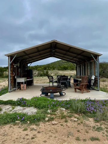 a view of a chairs and tables in patio