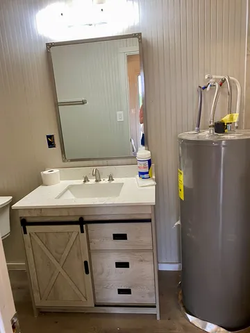 a bathroom with a sink and a mirror