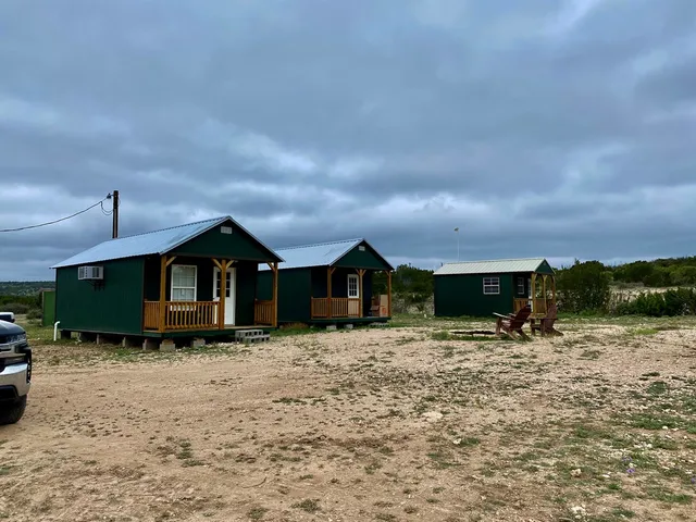a view of a house with a yard covered in snow