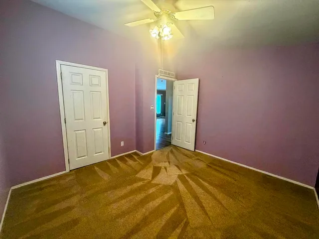 a bathroom with a toilet and shower curtain