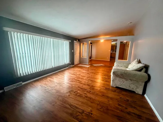 a view of livingroom with furniture and wooden floor