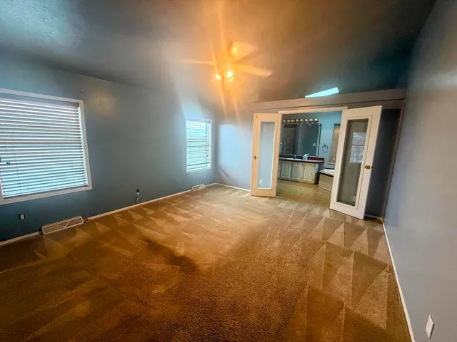 a bathroom with a tub sink and mirror