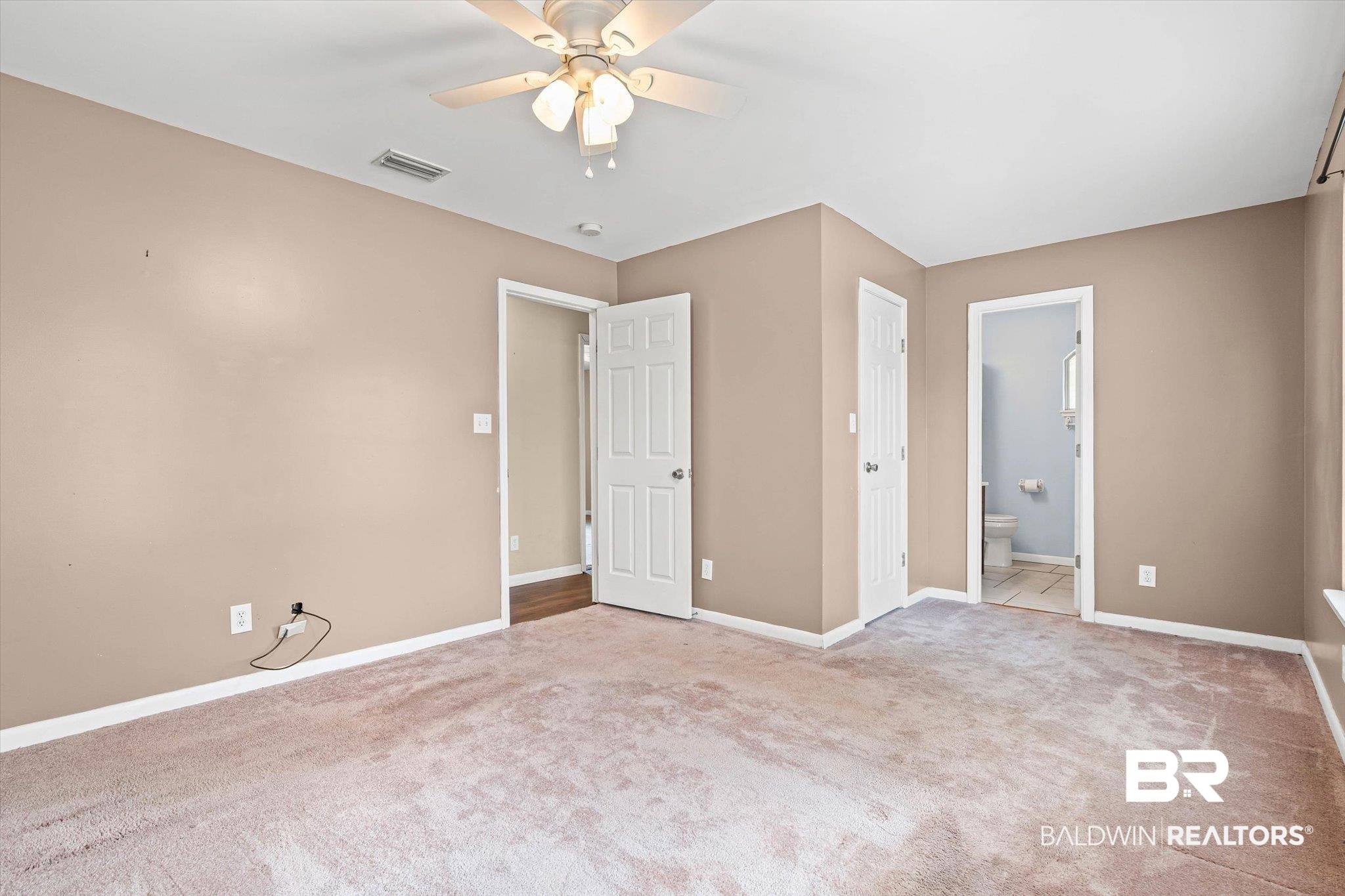 13908 White Road Silverhill, AL 36576 - Photo 13 of 23 Unfurnished bedroom featuring light colored carpet, a ceiling fan, and connected bathroom
